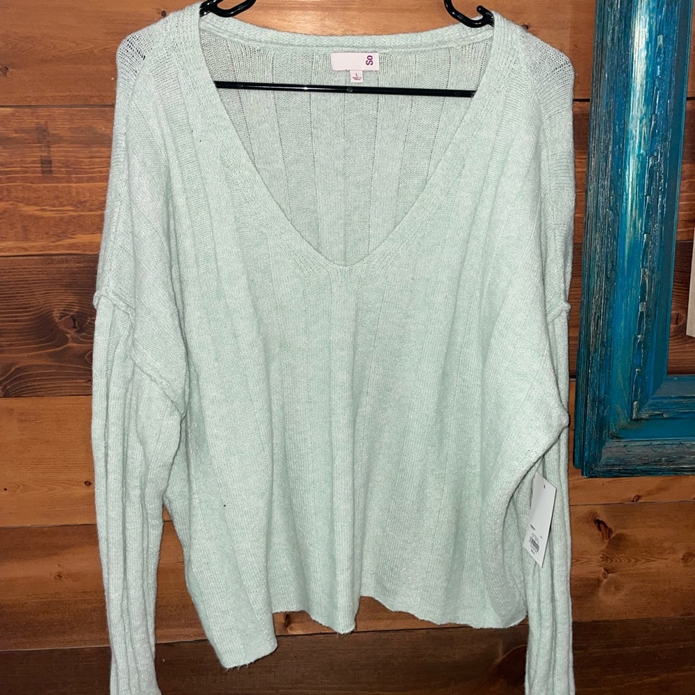 Green V neck sweater